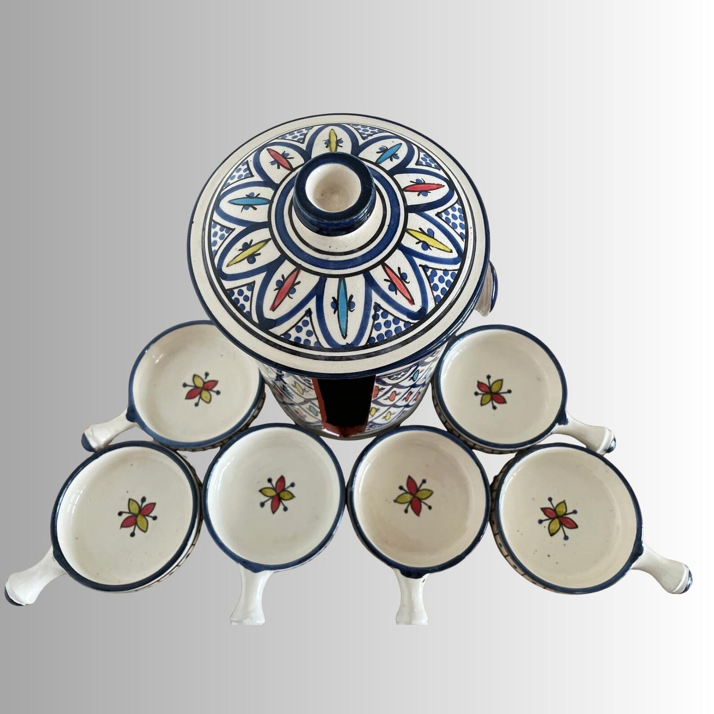 Handmade Safi blue ceramic serving set featuring floral mezze and condiment bowls.
